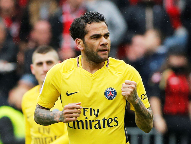 Paris Saint-Germain’s Dani Alves celebrates scoring their second goal against OGC Nice during their Ligue 1 match at Allianz Riviera, in Nice on Sunday