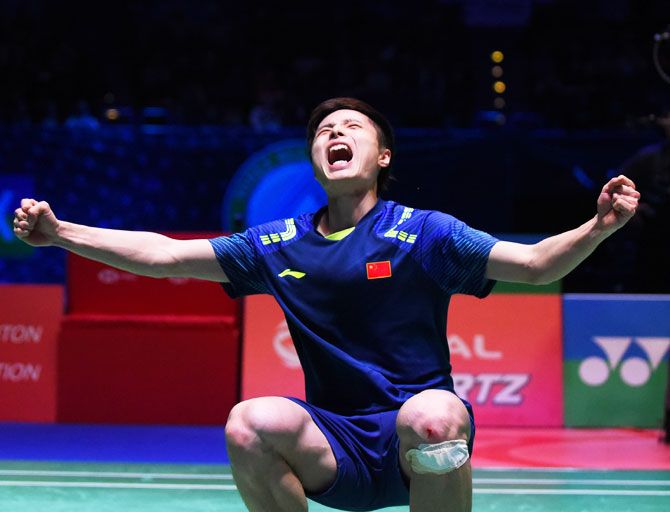 China's Shi Yuqi celebrates after beating China's Lin Dan in the men's singles final the Yonex All England Open Badminton Championships at Arena Birmingham in Birmingham, England, on Sunday