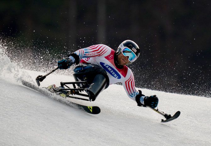 USA's Tyler Walker competes in the Alpine Skiing Sitting Men's Giant Slalom Run 2