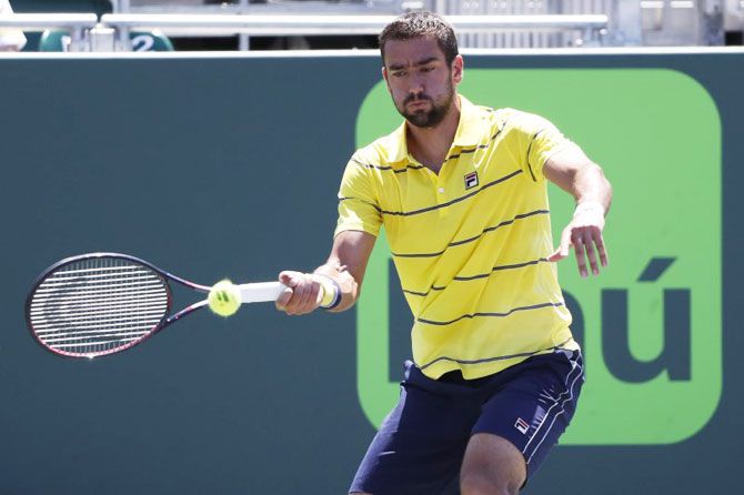 Croatia's Marin Cilic hits a forehand against Canada's Vasek Pospisil (not pictured) on day six of the Miami Open at Tennis Center at Crandon Park on Sunday