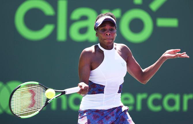 Venus Williams plays a shot against the Netherlands' Kiki Bertens