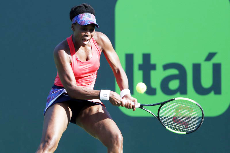 USA's Venus Williams hits a backhand against Great Britain's Johanna Konta