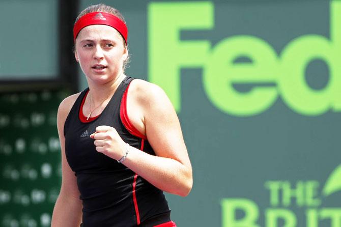 Latvia's Jelena Ostapenko reacts after winning a point against Ukraine's Elina Svitolina