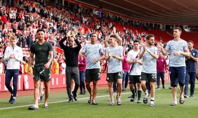 Manchester City manager Pep Guardiola and his players applaud fans after the match against Southampton on Sunday