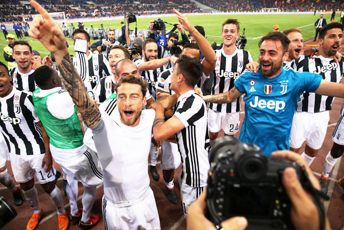 Juventus' Claudio Marchisio and teammates celebrate after winning the Serie A title on Sunday