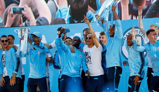 Manchester City players celebrate their English Premier League title win