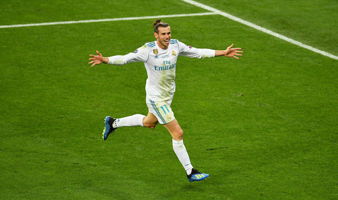 Real Madrid's Gareth Bale celebrates scoring his side's winner, his second goal, during the UEFA Champions League final against Liverpool at NSC Olimpiyskiy Stadium in Kiev, Ukraine, on Saturday