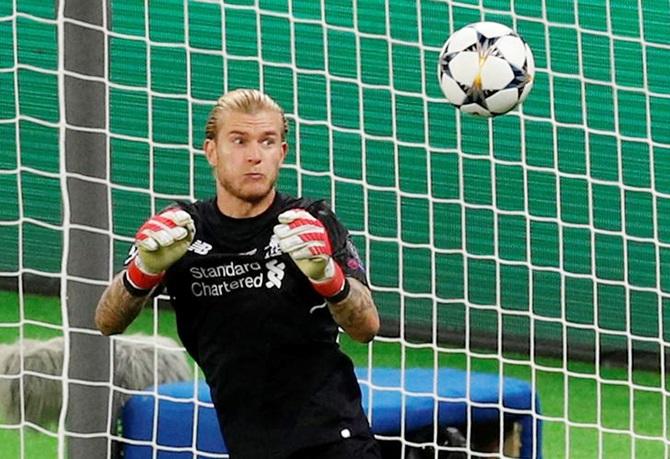 Liverpool's Loris Karius   fumbles the ball as Gareth Bale scores Real Madrid's  third goal