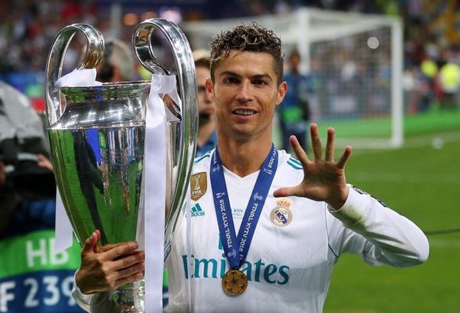 Real Madrid's Cristiano Ronaldo gestures as he celebrates winning the Champions League against Liverpool in May