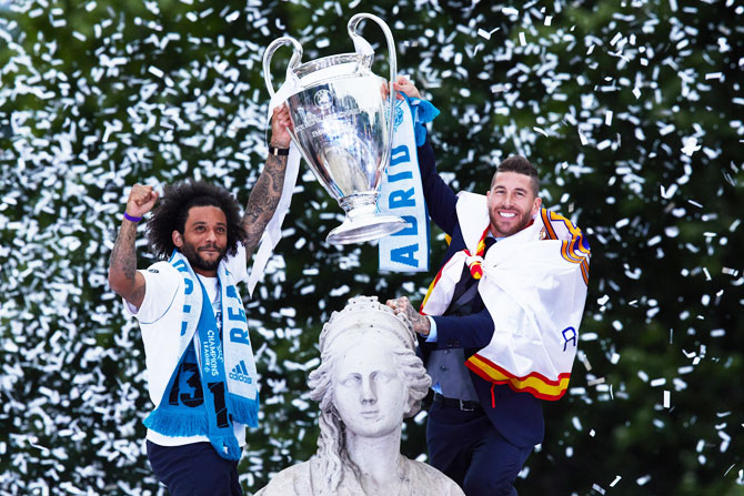 Real Madrid team celebrate their trophy at Cibeles Square