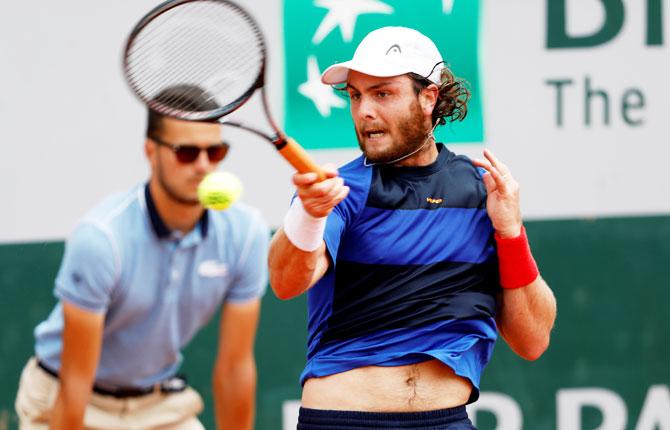 Argentina's Marco Trungelliti in action during his second round match against Italy's Marco Cecchinato in their 2nd round match