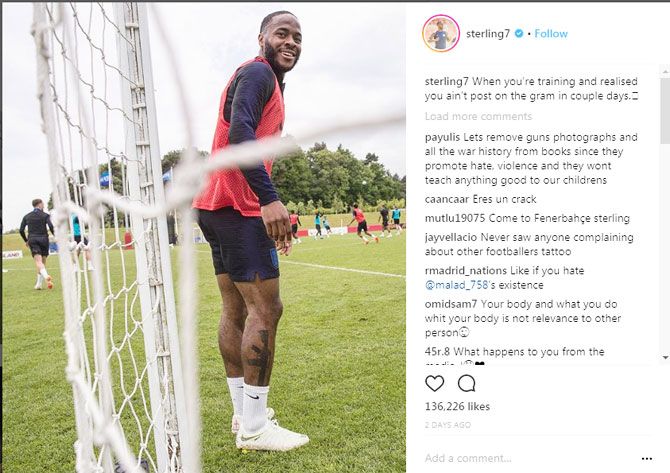 Manchester City's Raheem Sterling shows off his gun tattoo on an Instagram post