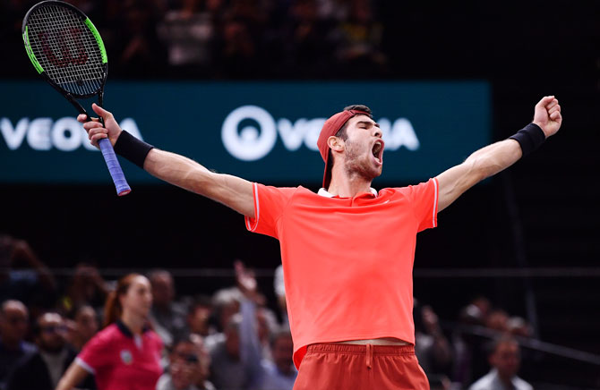 Russia's Karen Khachanov celebrates after defeating Serbia's Novak Djokovic to win the Paris Masters on Sunday