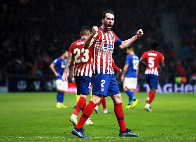 Atletico de Madrid's Diego Godin celebrates scoring their third goal against Athletic Club Bilbao during their La Liga match Club at Wanda Metropolitano stadium in Madrid on Saturday