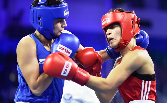 India's Sonia (blue) fights against Morocco's Toujani Doaa in Women's 57 kg category bout during AIBA Women's World Boxing Championships at IG Stadium in New Delhi on Saturday