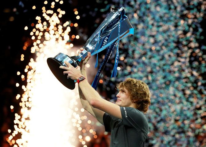 Germany's Alexander Zverev celebrates with the trophy after winning the final of the ATP World Tour Finals in London on Sunday