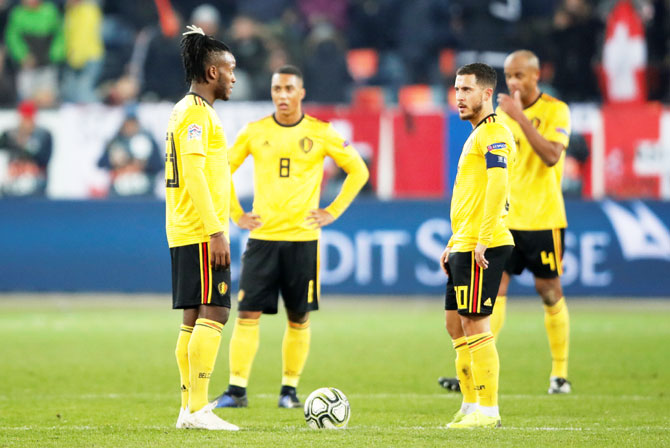 Switzerland's Haris Seferovic scores their fifth goal to complete his hat-trick in the match against Belgium 