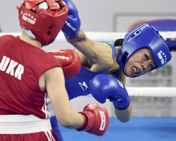 Mary Kom in action against Ukraine's Hanna Okhota during the AIBA Women's World Boxing Championships 48kg category final. Photograph: Ravi Choudhary/PTI