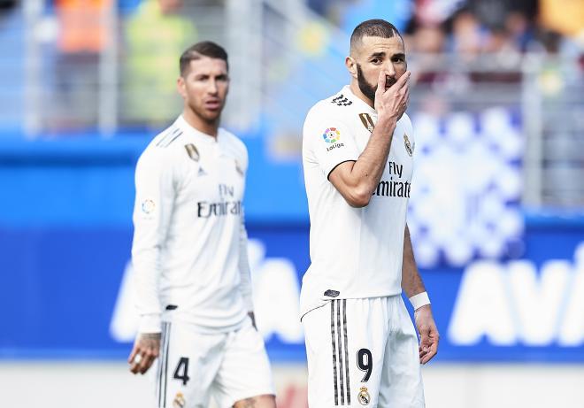 Real Madrid's Karim Benzema and Sergio Ramos (background) wear a dejected look during their La Liga match against SD Eibar at Ipurua Municipal Stadium in Eibar on Sunday