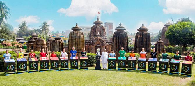 Captains of the teams participating in the Hockey World Cup join Odisha Chief Minister Naveen Patnaik for a picture at Mukteshwar Temple, in Bhubaneswar on Monday