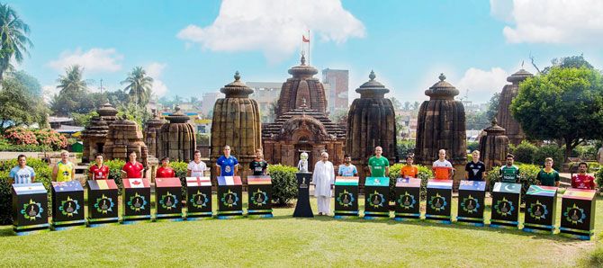 Captains of the teams participating in the Hockey World Cup join Odisha Chief Minister Naveen Patnaik for a picture at Mukteshwar Temple, in Bhubaneswar on Monday
