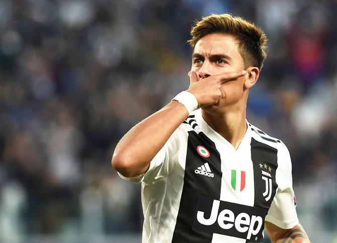 Juventus' Paulo Dybala celebrates scoring their first goal against BSC Young Boys during their Champions League  Group H match at Allianz Stadium in Turin on Tuesday