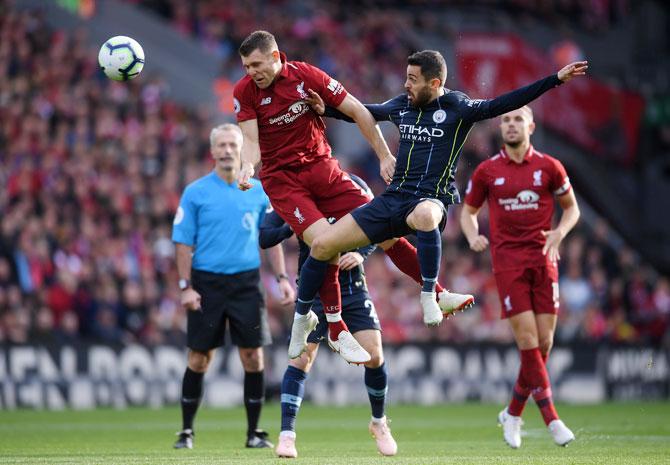 Manchester City's Gabriel Jesus is tackled by Liverpool's Dejan Lovren during their Premier League match at Anfield in Liverpool on Sunday