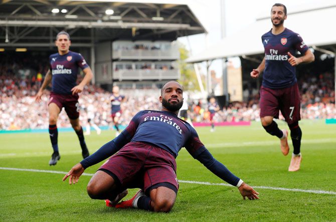 Arsenal's Alexandre Lacazette celebrates scoring their second goal against Fulham during their EPL match at Craven Cottage in London on Sunday