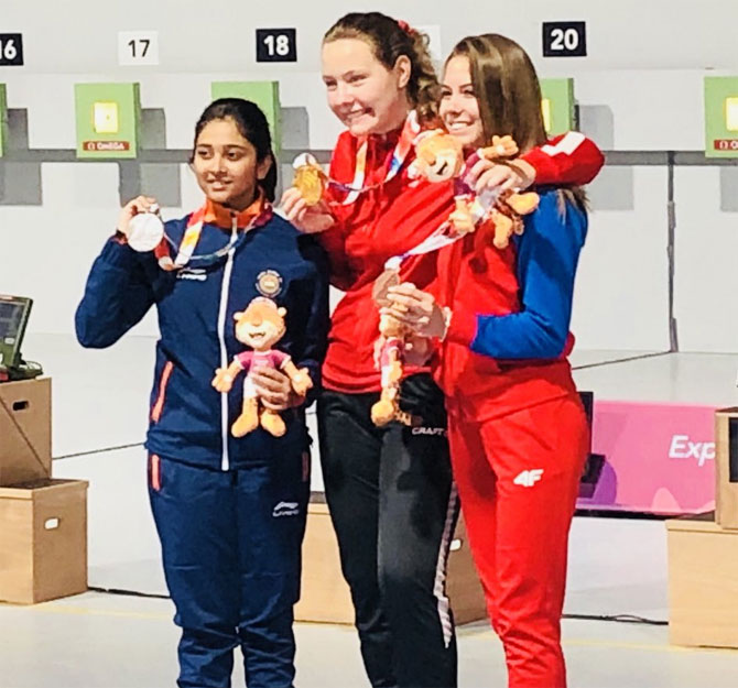 India's Mehuli Ghosh (extreme left) celebrates on the podium after winning the silver on Monday