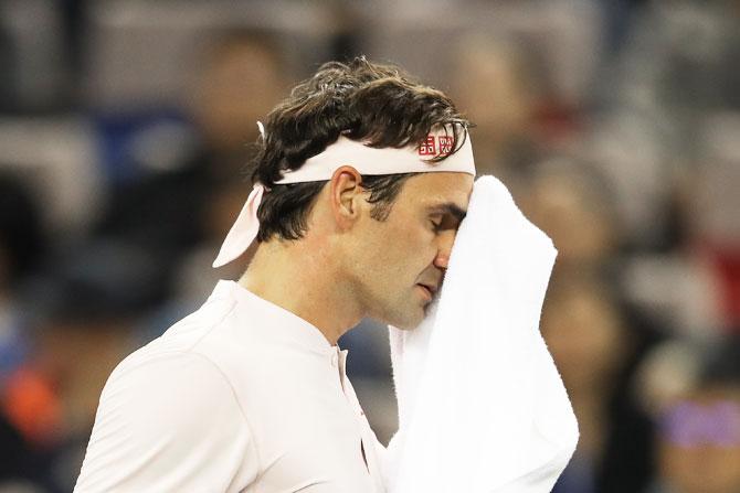 Switzerland's Roger Federer reacts during his semi-final against Croatia's Borna Coric at the Shanghai Masters at Qi Zhong Tennis Centre in Shanghai, China, on Saturday