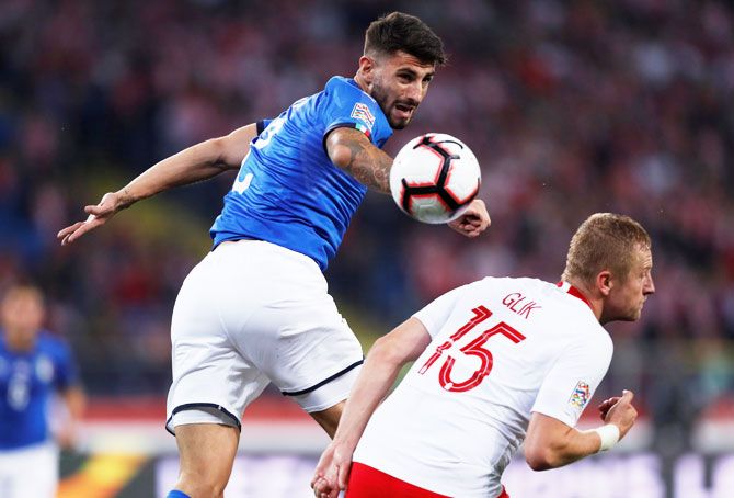 Italy's Cristiano Piccini in action with Poland's Kamil Glik during their Nations League match at the Silesian Stadium, in Chorzow, Poland, on Sunday