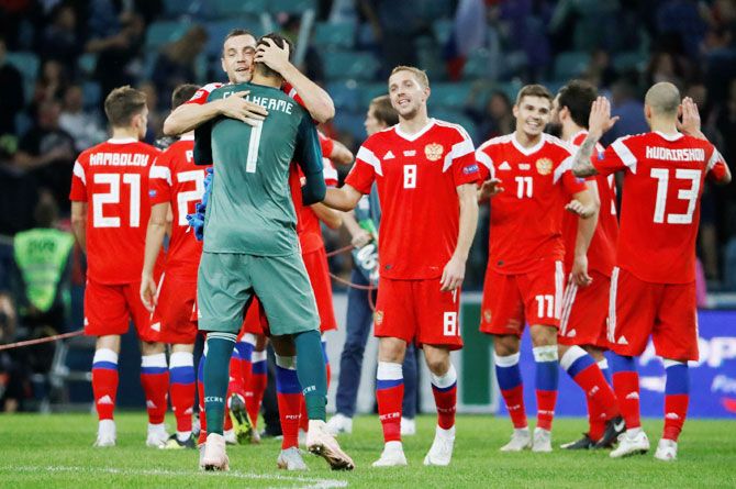 Russia's Artem Dzyuba and Guilherme celebrate after the match against Turkey at Fischt Stadium in Sochi on Sunday