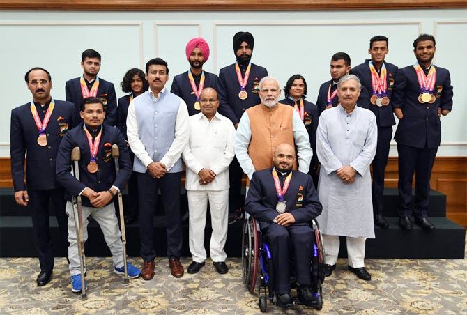 Prime Minister Narendra Modi and Sports Minister Rajyavardhan Singh Rathod meet para athletes in New Delhi on Tuesday