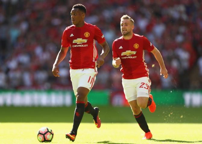 Manchester United's Anthony Martial, left, and Luke Shaw