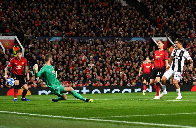 Paulo Dybala beats Manchester United Goalkeeper David de Gea to scores Juventus's goal, a Champions League game ManU lost 1-0, October 22, 2018. Photograph: Michael Regan/Getty Images