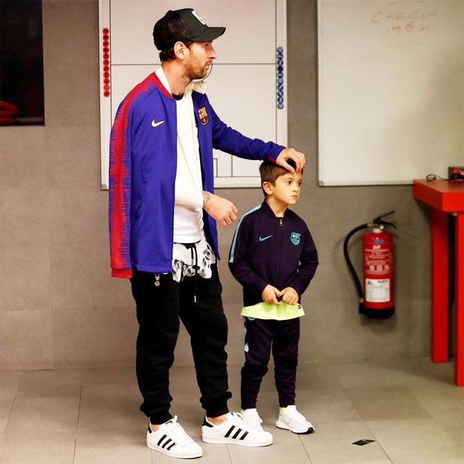 Lionel Messi with his son before FC Barcelona's Champions League match against Inter on Wednesday