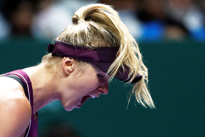 Ukraine's Elina Svitolina celebrates winning her group stage match of WTA Tour Finals against Denmark's Caroline Wozniacki at the Singapore Indoor Stadium in Kallang, Singapore on Thursday