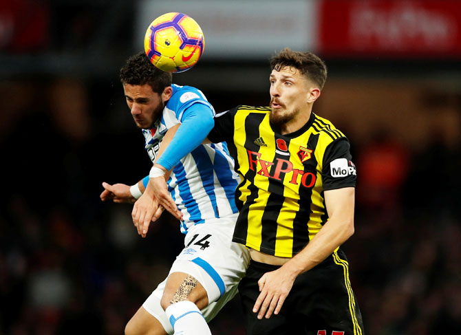 Huddersfield Town's Ramadan Sobhi and Watford's Craig Cathcart vie for possession