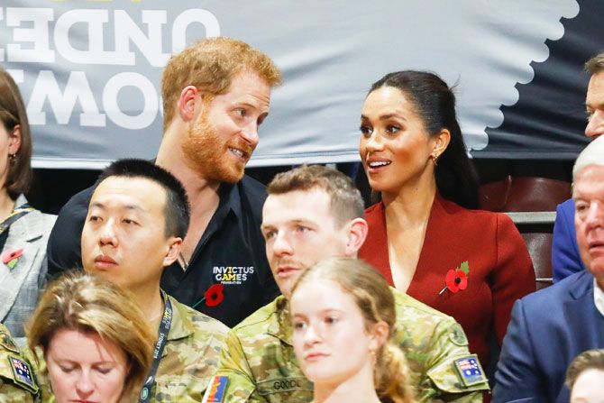 Prince Harry, Duke of Sussex and Meghan, Duchess of Sussex watch Netherlands and United States of America compete in the Wheelchair Basketball Gold medal match on day 8 of the Invictus Games in Sydney on Saturday