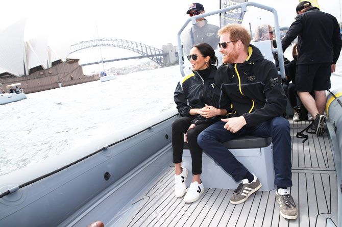 Britain's Prince Harry and Meghan, Duchess of Sussex on Sydney Harbour looking out at Sydney Opera House and Sydney Harbour Bridge on Day 2 of the Invictus Games at Sydney Olympic Park on Sunday, October 21