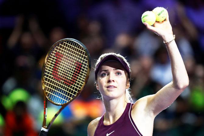 Ukraine's Elina Svitolina celebrates after winning her semi-final match againast Netherlands' Kiki Bertens at the WTA Finals at the Singapore Indoor Stadium in Kallang, Singapore, on Saturday