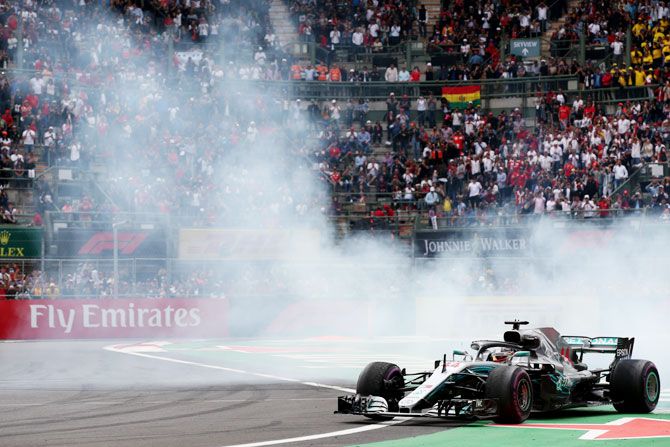 Lewis Hamilton performs donuts as he celebrates winning the 2018 F1 World Drivers Championship on Sunday