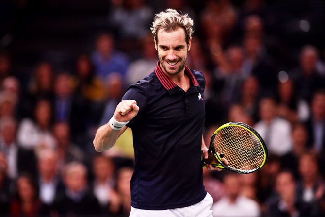 France's Richard Gasquet celebrates after winning the match against Canada's Denis Shapovalov on Day 1 of the Rolex Paris Masters in Paris, France, on Monday