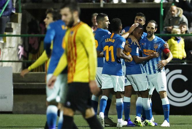 Atletico Madrid players celebrate a goal by Gelson Martins against Sant Andreu durinng their Copa del Rey round of 32 first-leg match on Tuesday