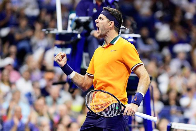 Argentina's Juan Martin Del Potro celebrates a point during his men's singles third round match against Spain's Fernando Verdasco on Friday