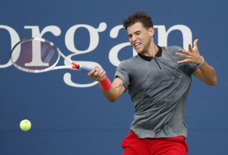 Austria's Dominic Thiem returns a shot against USA's Taylor Fritz in a third round match at USTA Billie Jean King National Tennis Center