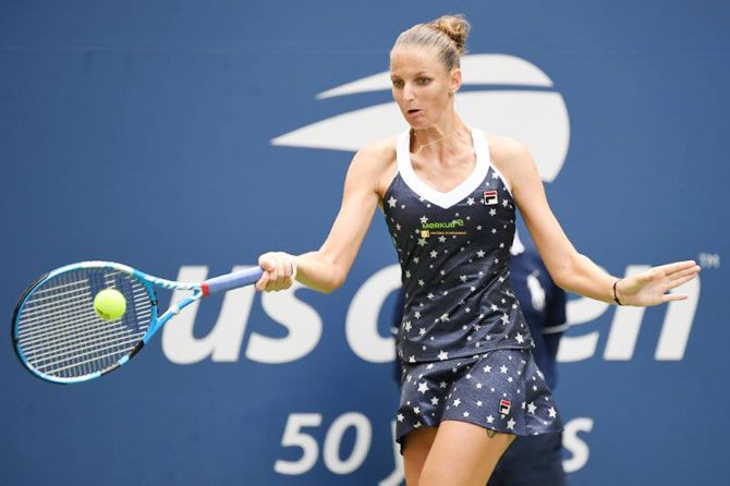 Czech Republic's Karolina Pliskova play a return against Australia's Ashleigh Barty in a fourth round match 
