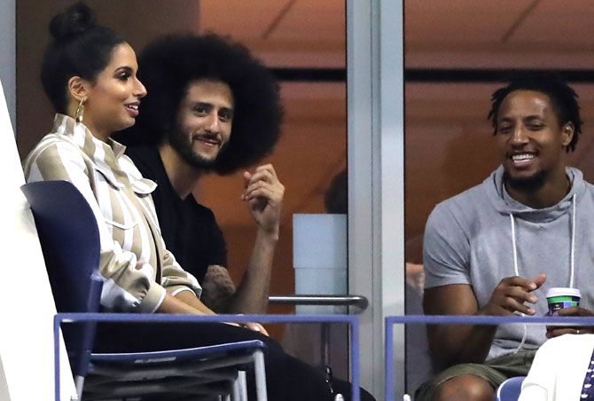 Former quarterback, Colin Kaepernick watches from the stands during the ladies singles third round match between Serena Williams and Venus Williams last week