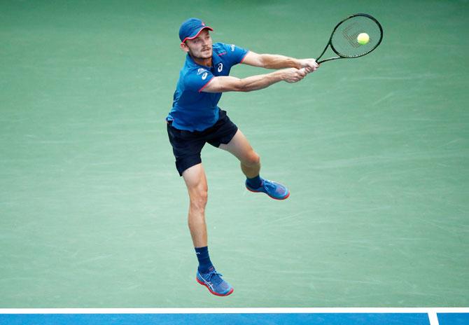 David Goffin plays a return against Marin Cilic