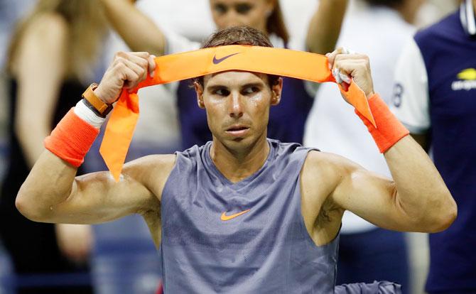 Rafael Nadal takes a break between sets 